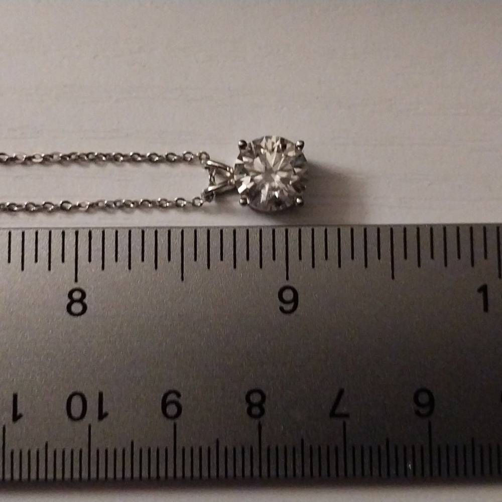 Sterling silver necklace w/ a 2ct mossinate stone.